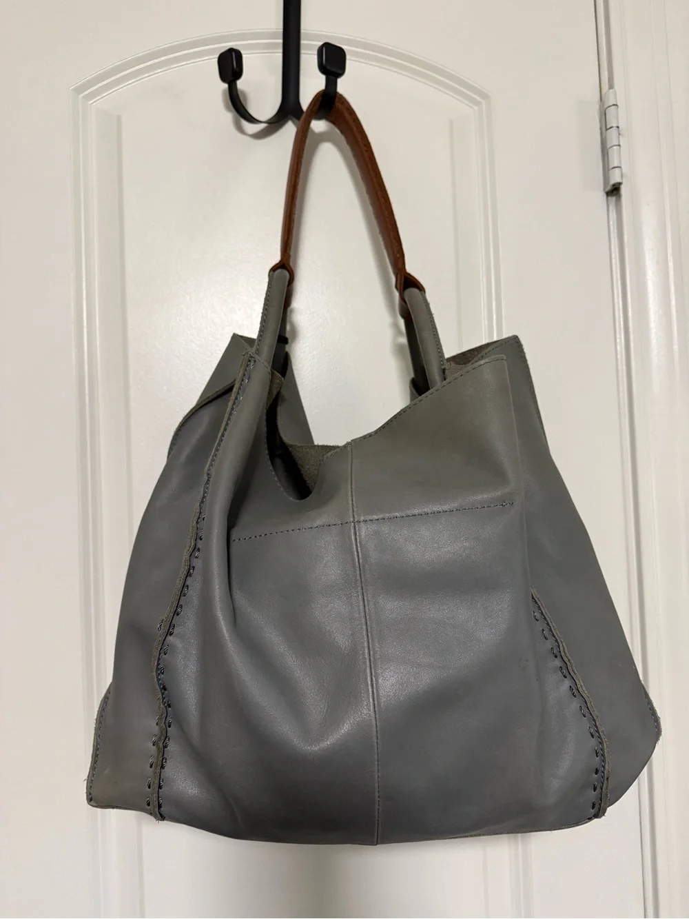 The Sak Gray Leather Hobo Shoulder Bag with Brown Strap and Tassels